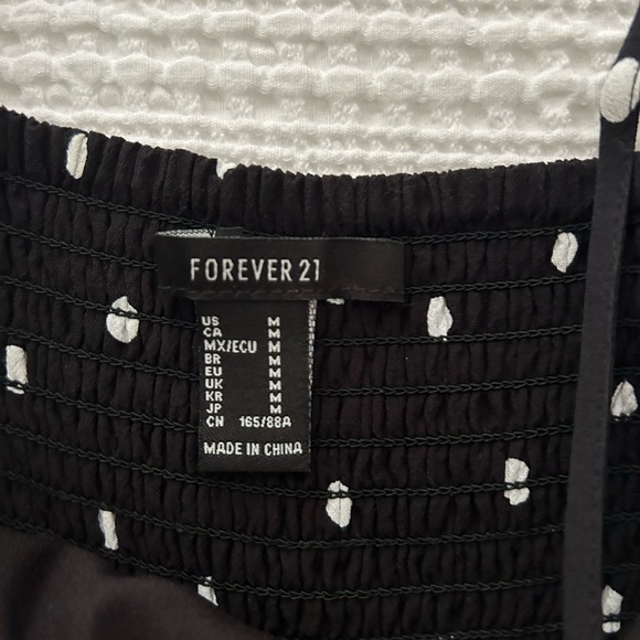 Black mini dress with white polka dots - Picture 2 of 3